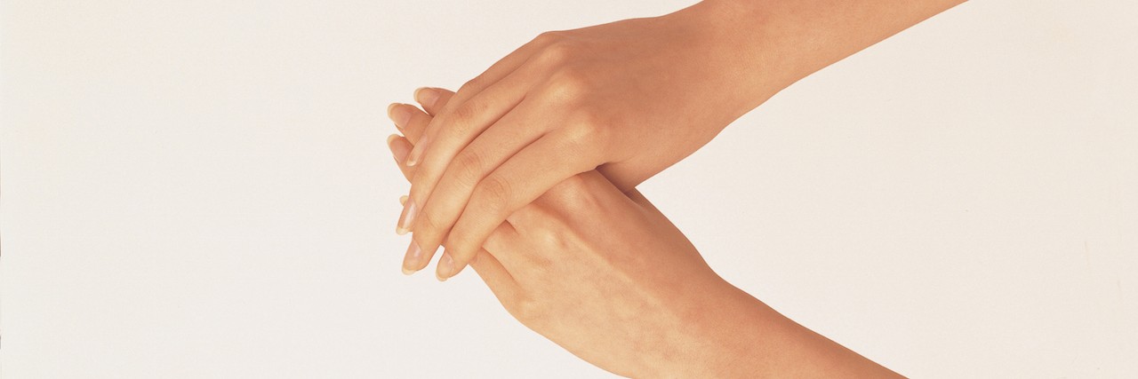 Realizing That Skin-Picking Can Be Mental Illness: Dermatillomania Two hands reaching out
