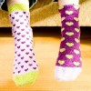 a childs feet clad in novelty socks