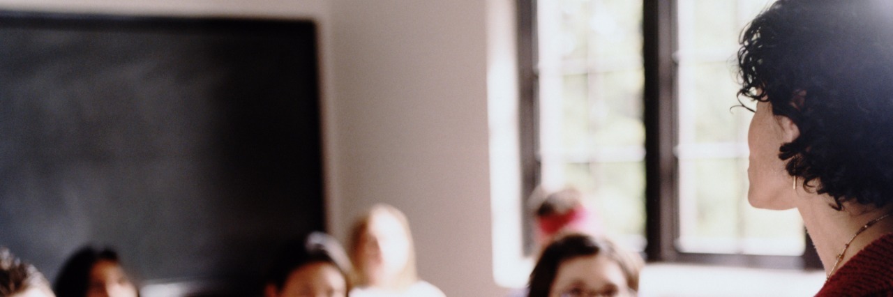 A Mom's Letter to Teachers of Students on the Autism Spectrum Teacher talking in front of students in classroom