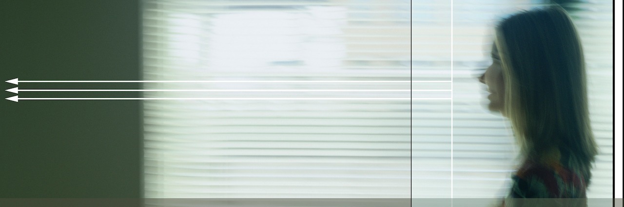 Inside the Mind of Someone With Mental Illness and Suicidal Thoughts woman walking down a hallway