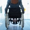 the back of a woman in a wheelchair