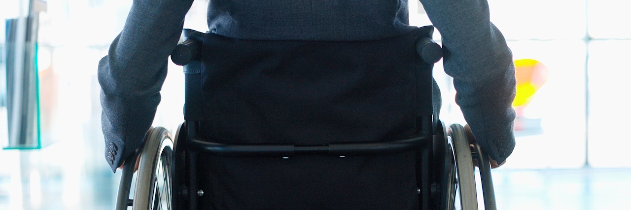 Autoimmune Disease: Getting a Wheelchair When You Can Walk the back of a woman in a wheelchair