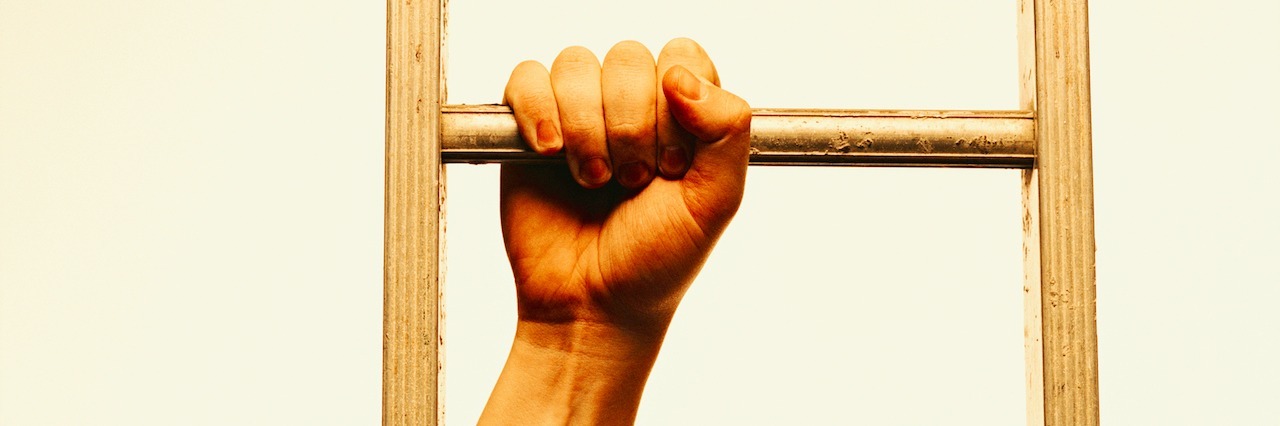 Moving On After an Episode With Anxiety and Depression close-up of hands climbing a ladder