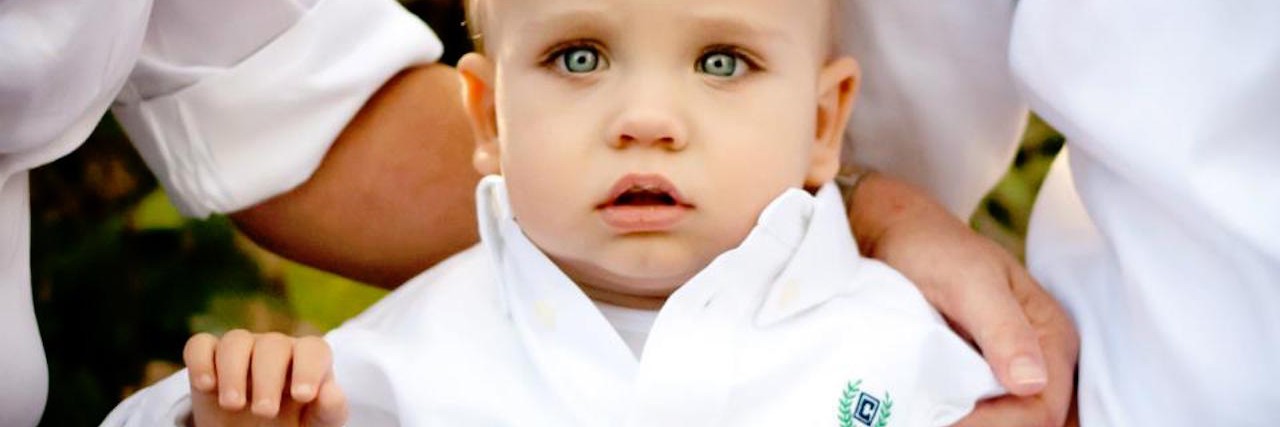 Going Gold for Childhood Cancer Awareness Month in September little boy in karate suit