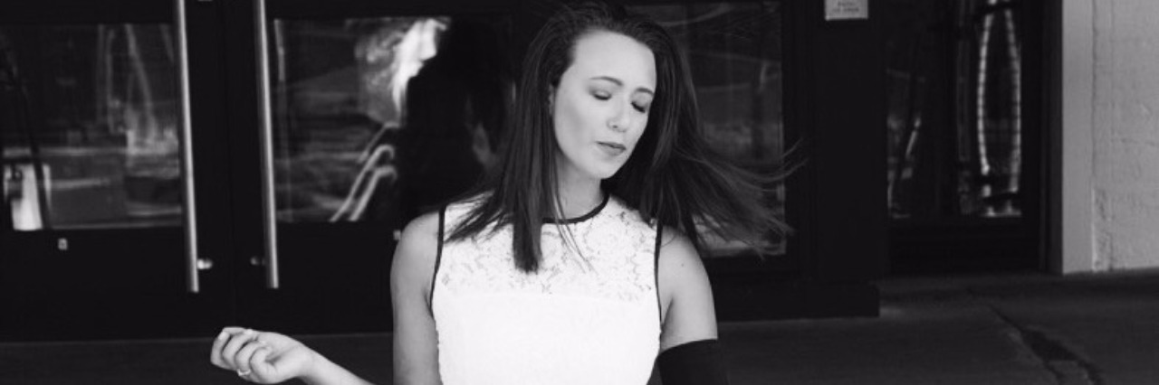 Starting Lyme Disease Treatments Instead of Going to Work black and white image of woman wearing white dress walking down steps