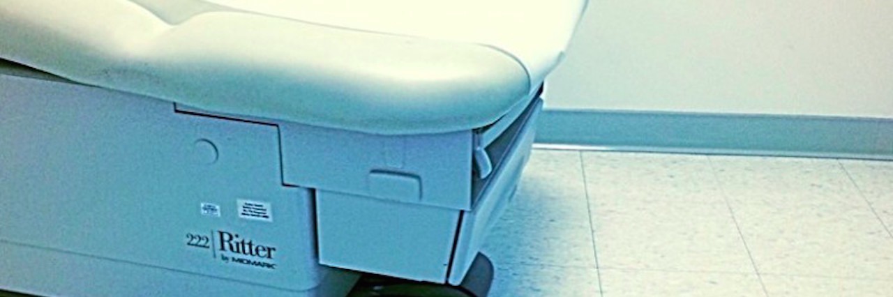 Why It's Scary to Deal With New Diagnoses When You're Chronically Ill pink shoes and exam table in doctor's office