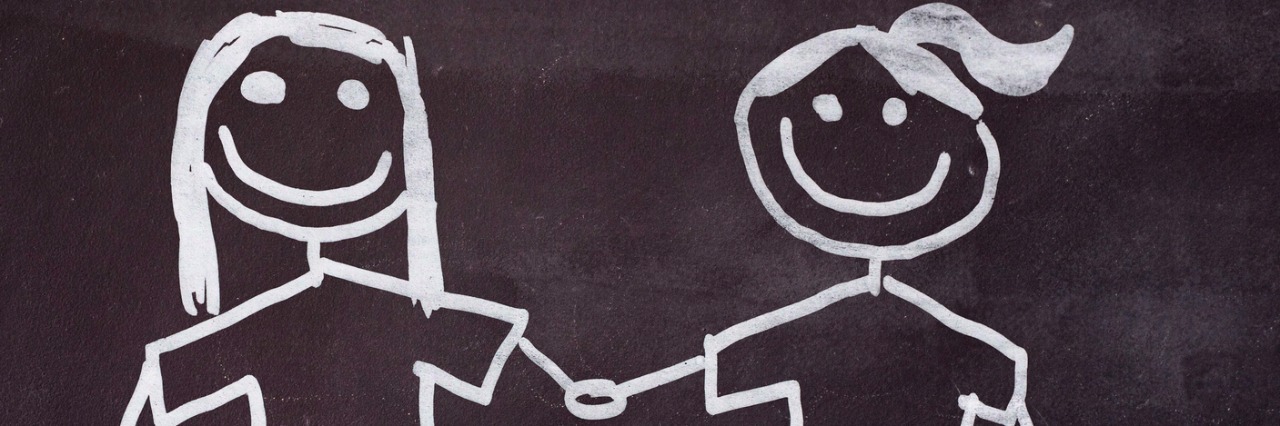 How to Be an Ally to Someone with an Invisible Illness Couple of girls drawn on a blackboard.
