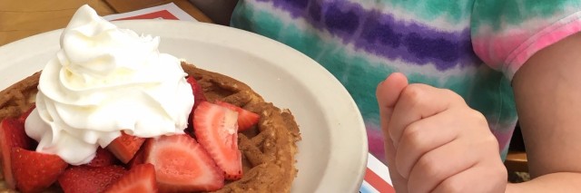 girl eating a gluten-free waffle