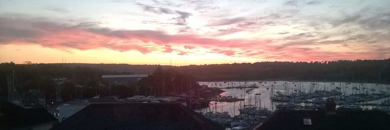 What I Do When I Can't Sleep Because of Chronic Pain sunrise over houses and neighborhood