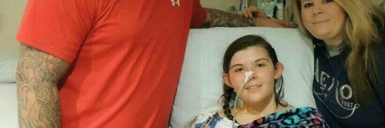 What Parents of Children With Chronic Diseases Should Hear The author in a hospital bed with her mom and dad beside her