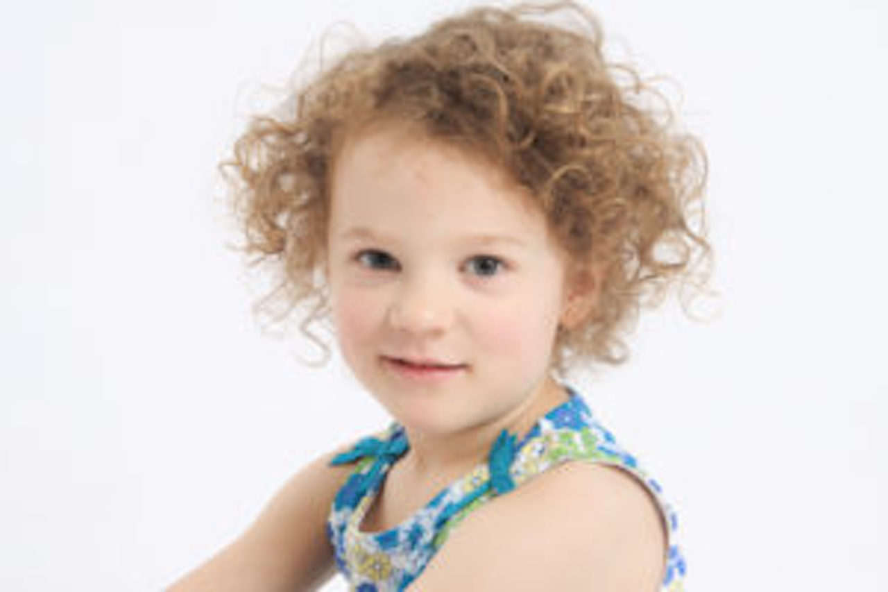 little girl with dirty blonde curly hair