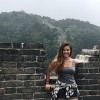 young woman posing at the Great Wall of China