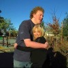 Taylor Cross and his mom Keri, hugging outdoors
