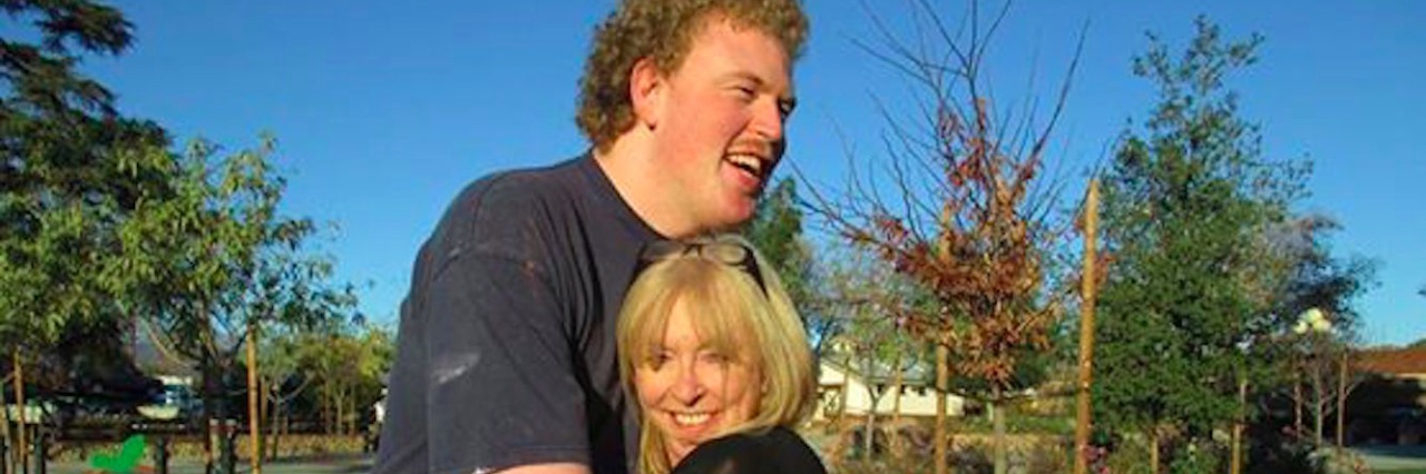 Interview With Taylor Cross About Making 'Normal People Scare Me Too' Taylor Cross and his mom Keri, hugging outdoors