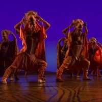 Scene from The Lion King on Broadway - performers dancing dressed as lions