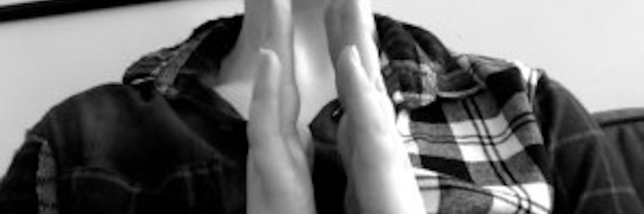 What Borderline Personality Disorder Feels Like woman making the sign for love