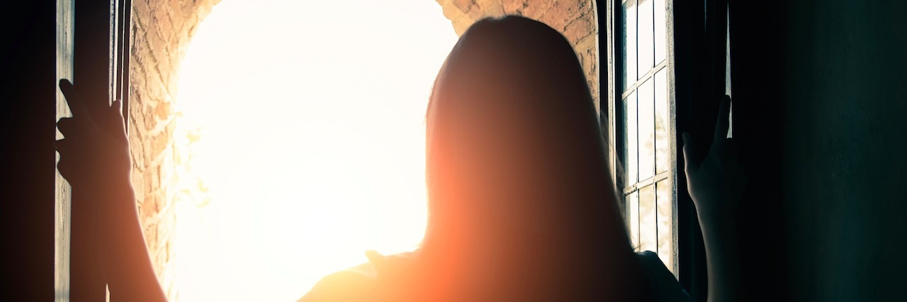 What It's Like Having Chronic Fatigue Syndrome and Getting Better Silhoutte of woman opening window