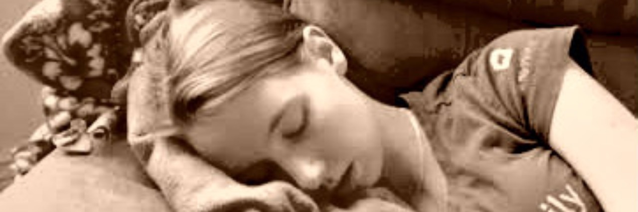 My Review of My Trip to the ER for Lyme Disease and Endometriosis girl lying on couch on blanket