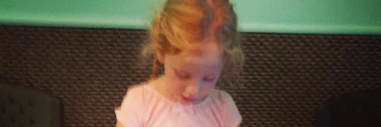 Mom Asks for Inclusion of Autistic Daughter in Dance Class little girl with autism sitting in a dance class