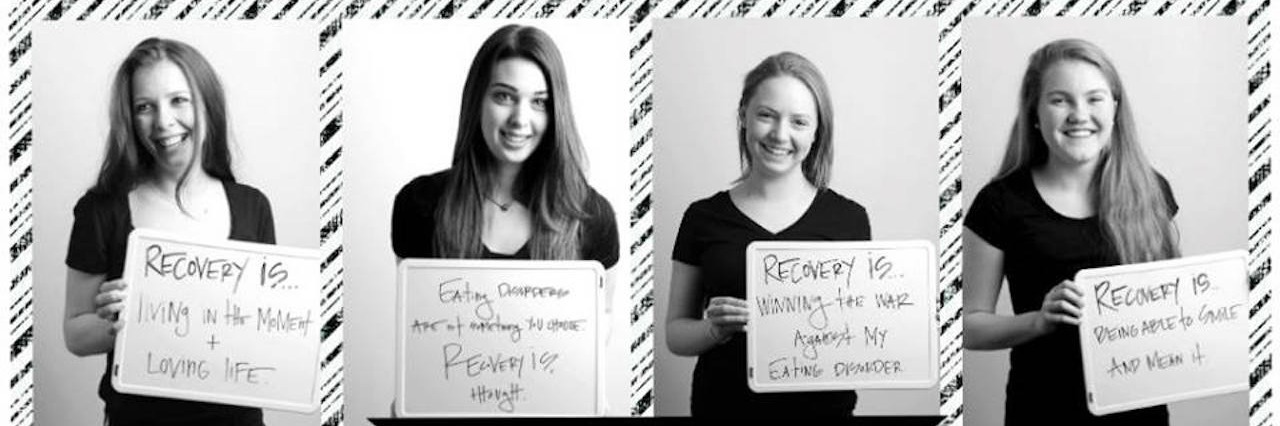 What to Do If You're Afraid of Eating Disorder Recovery a college of girl holding signs about recovery
