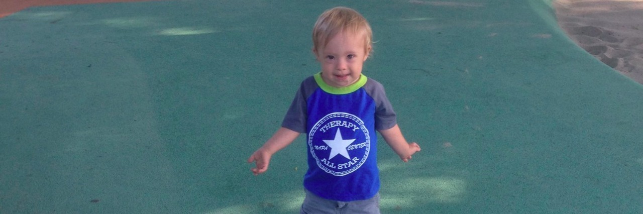 Mom's Response to People Who Don't Want a Child With Down Syndrome little boy with down syndrome at the park