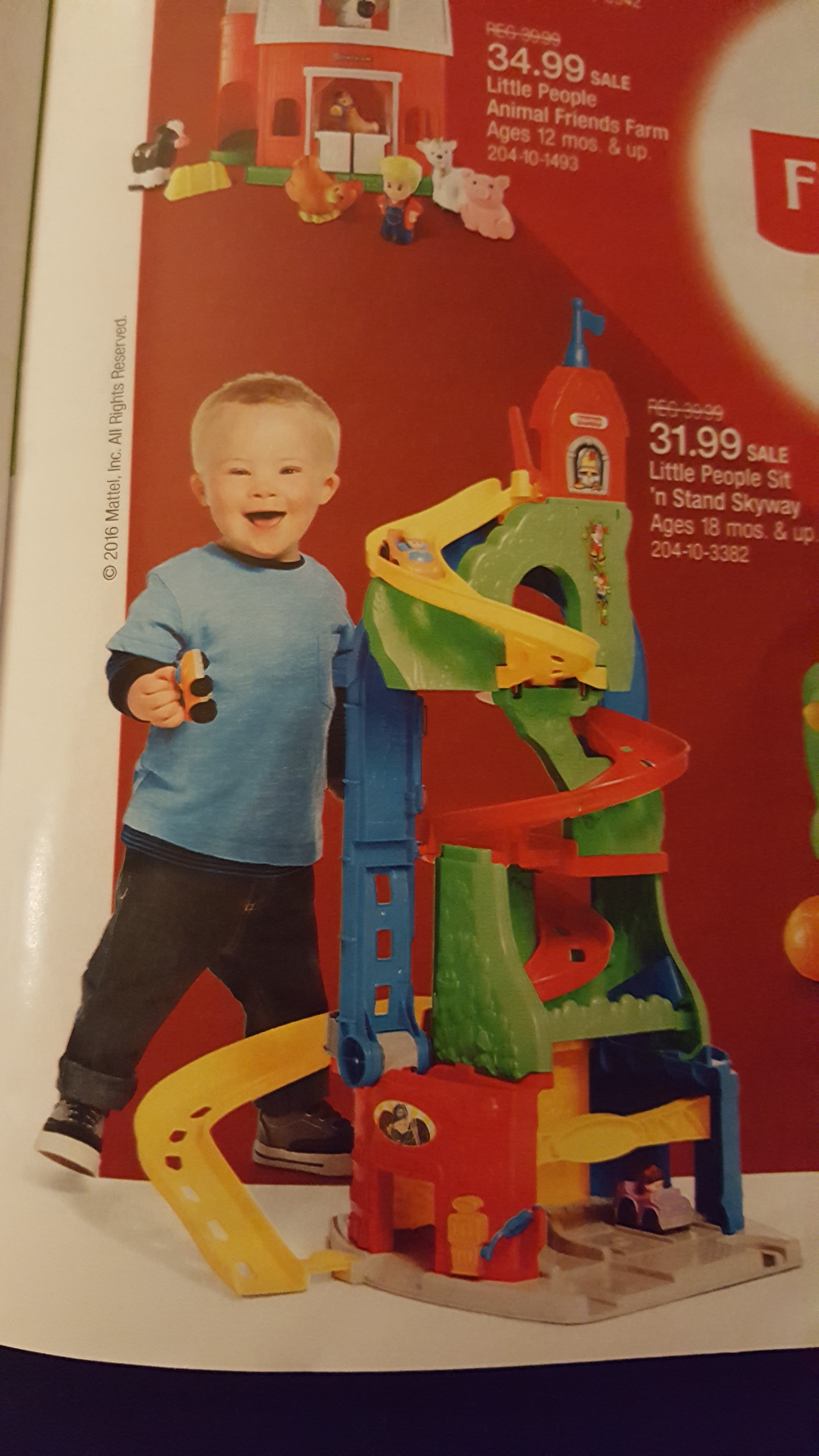 little boy with down syndrome in target's toy book