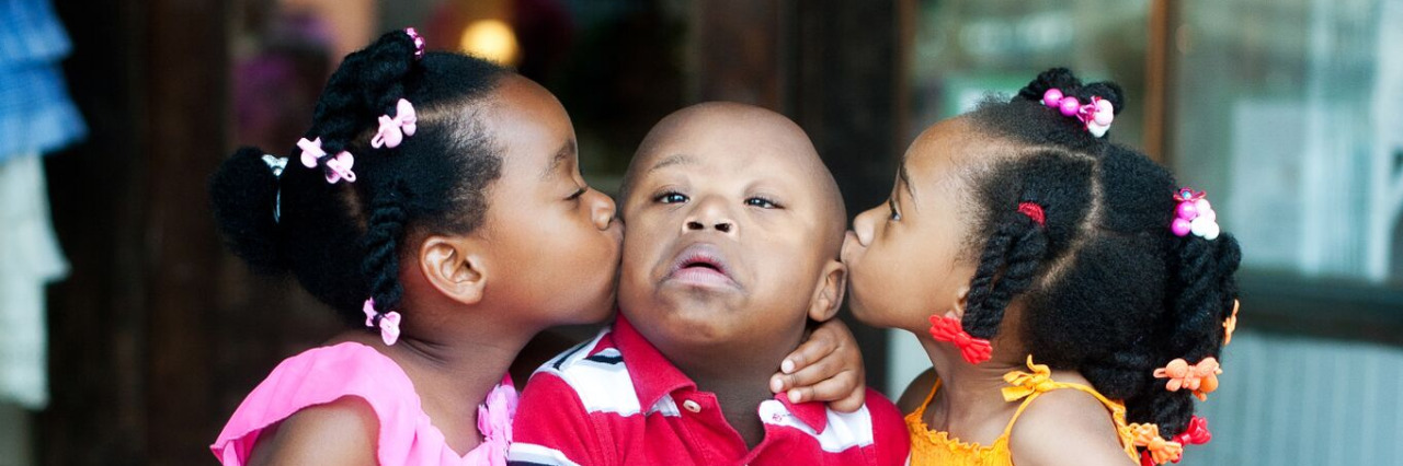 Teaching Future Genetic Counselors to Give a Down Syndrome Diagnosis Allan and his sisters. Photo by Comfort Photography, Columbus, OH. www.comfortphotography.com.