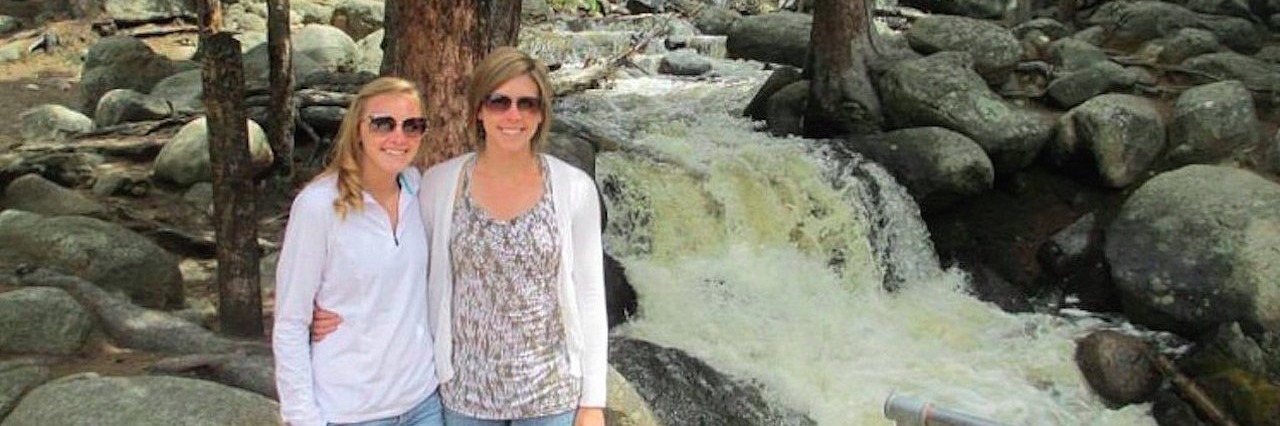 Accepting My Life With a Chronic Illness two young woman standing next to a rushing stream