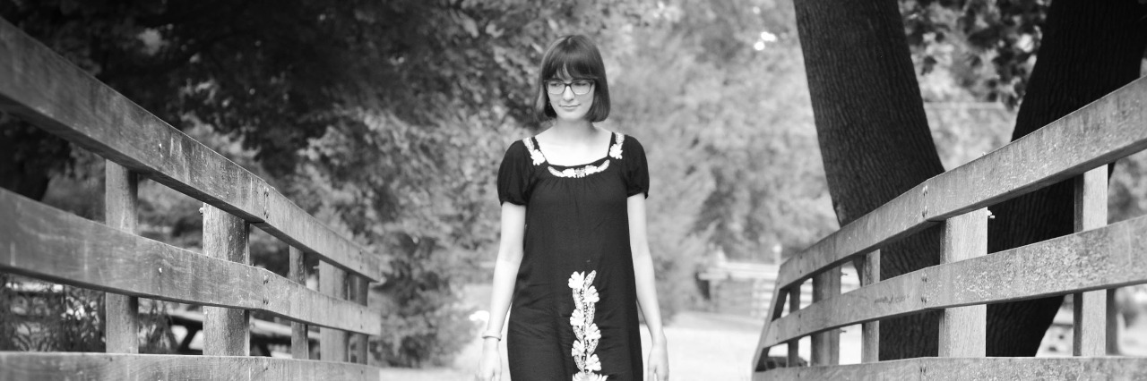 Letter to People Who Think They Can't Talk About Their Anxiety girl walking on a bridge