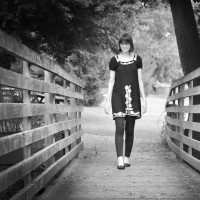 girl walking on a bridge