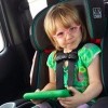 young girl in a car seat