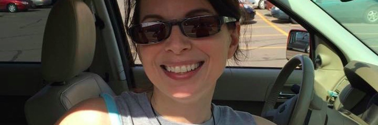Transverse Myelitis: Stop Telling Me I Am Going to Get Better woman in passenger seat of car