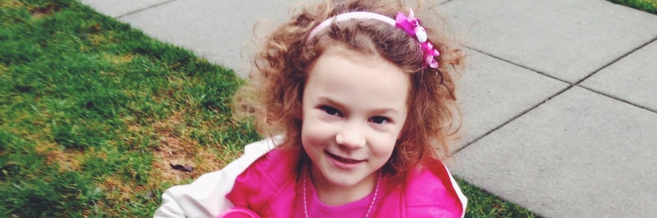 Child Loss: A Mother's Grief for Her Child Girl wearing a headband and pink dress with pink rainboots