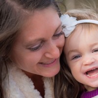 mom and girl smiling