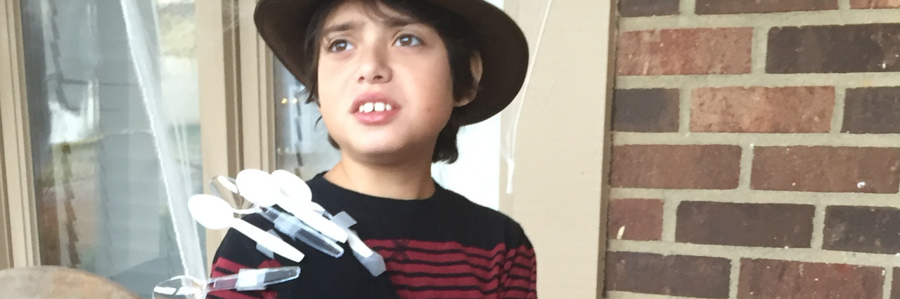 Making Halloween More Inclusive for Children With Special Needs Boy dressed as Freddy Krueger.