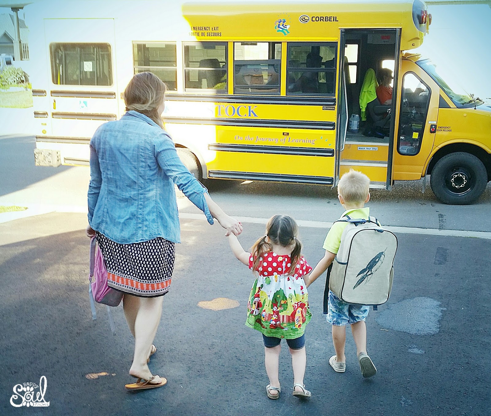 kids getting on the school bus