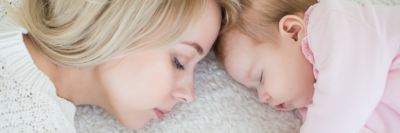 Postpartum Depression Doesn't Discriminate Mother and baby resting with their foreheads touching