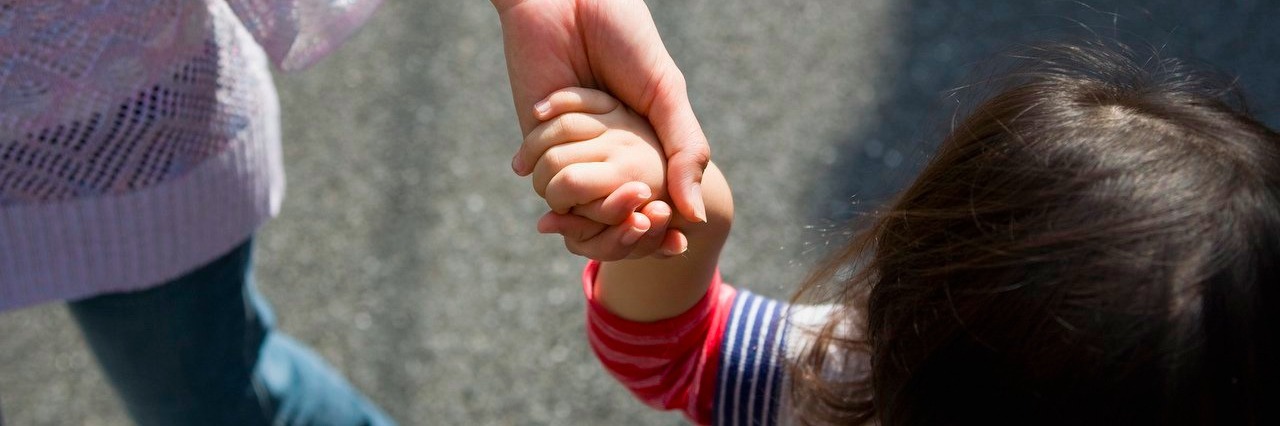 Support Parents If Their Child With Autism Wanders Away mother and son walking together