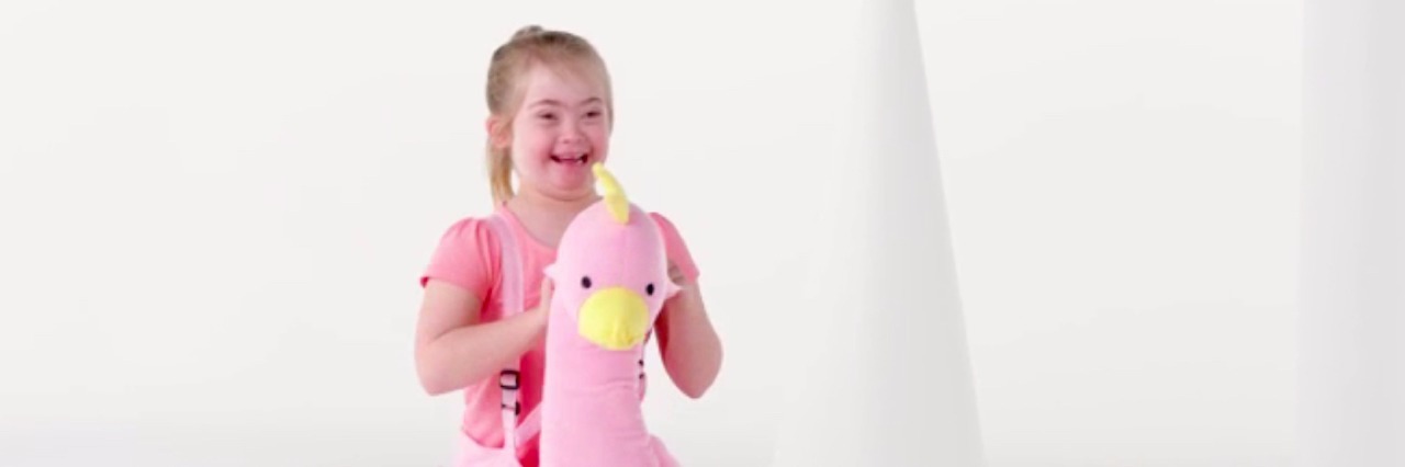 Kmart Australia Features Girl With Down Syndrome in Commercial girl dressed in a pink bird costume.