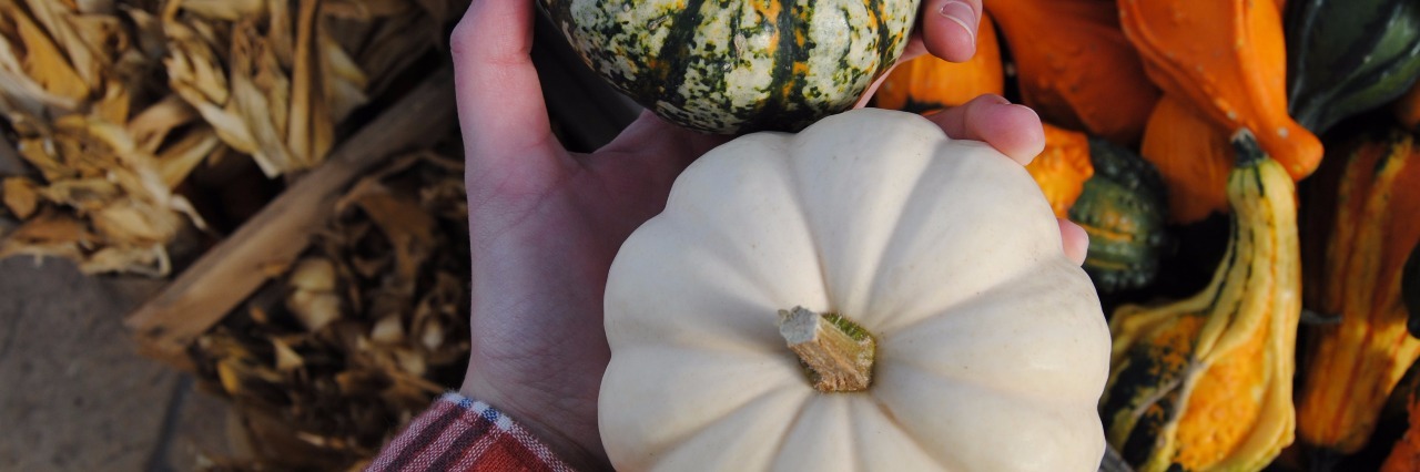 Lonely on Halloween Because of Ehlers-Danlos Syndrome hand holding two tiny pumpkins