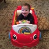 Miles in his toy car.