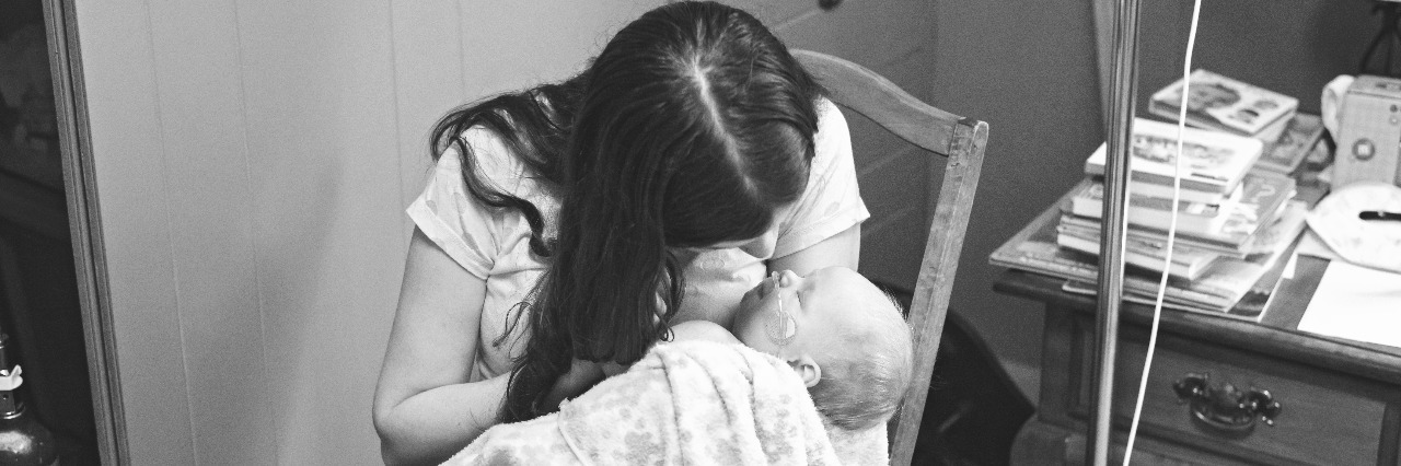 Why Being Sick Didn't Stop Me From Caring for My Terminally Ill Daughter Samantha holding Millie