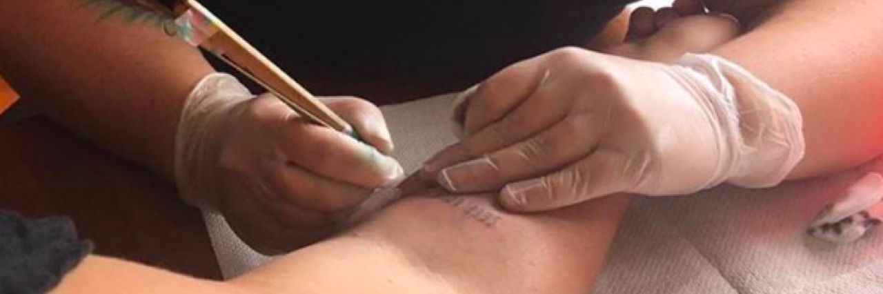 Frances Cannon Creates 'Self Love Club' Tattoo and Self-Care Community Cannon getting her tattoo.