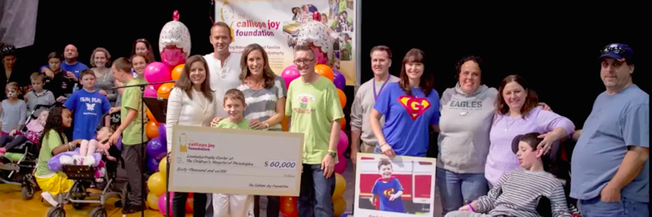 How We're Funding Miracles for Children With My Daughter's Rare Disease The Cal Foundation holding a check on stage