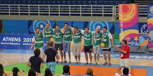Photo of Slovenian athletes at the Special Olympics wearing their medals.