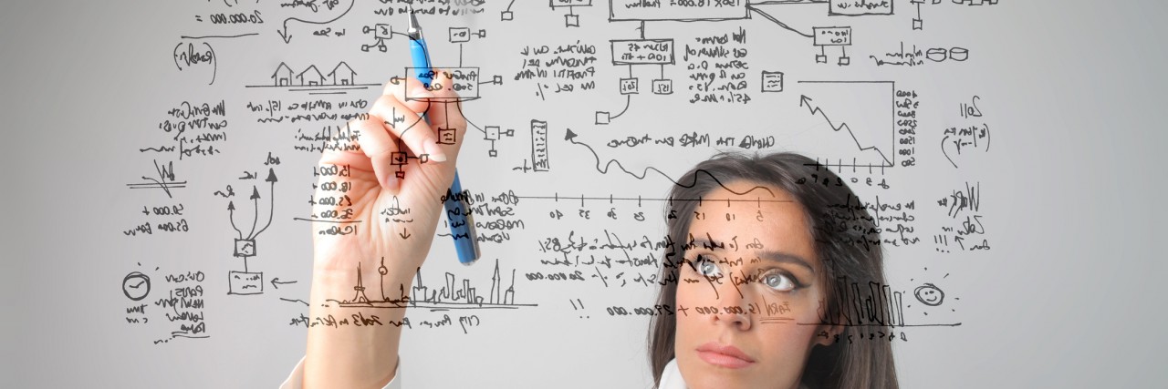 Smart, Intelligent, Gifted People Can Have Mental Illness, Too woman doing a math equation