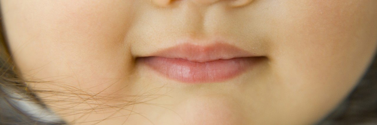 close up of a young girls mouth