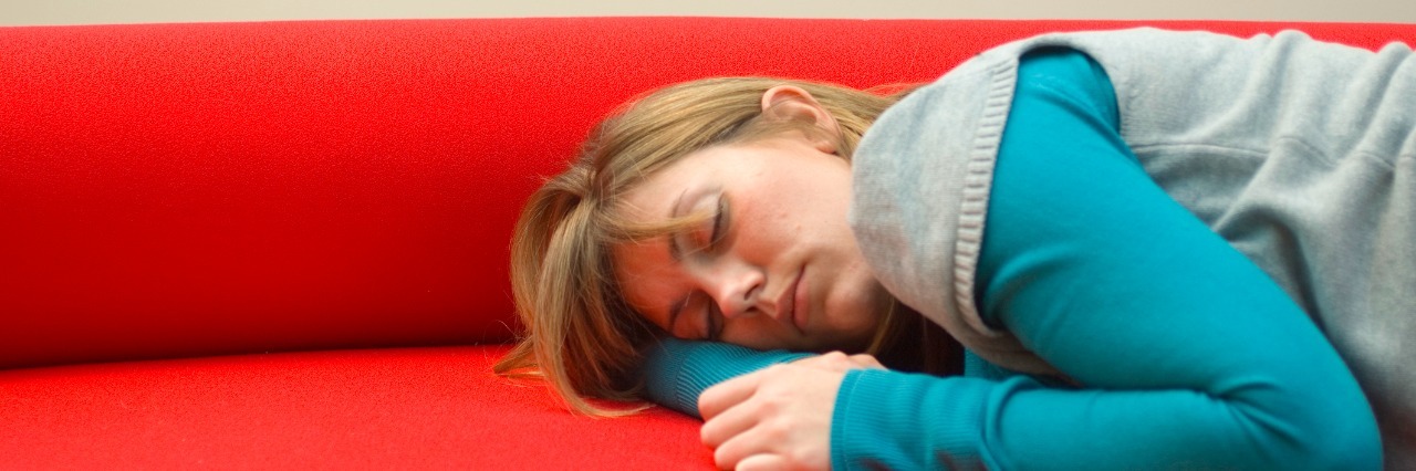 Why We Should Change 'Chronic Fatigue Syndrome' to 'Gray Area' Mid adult woman sleeping on a couch