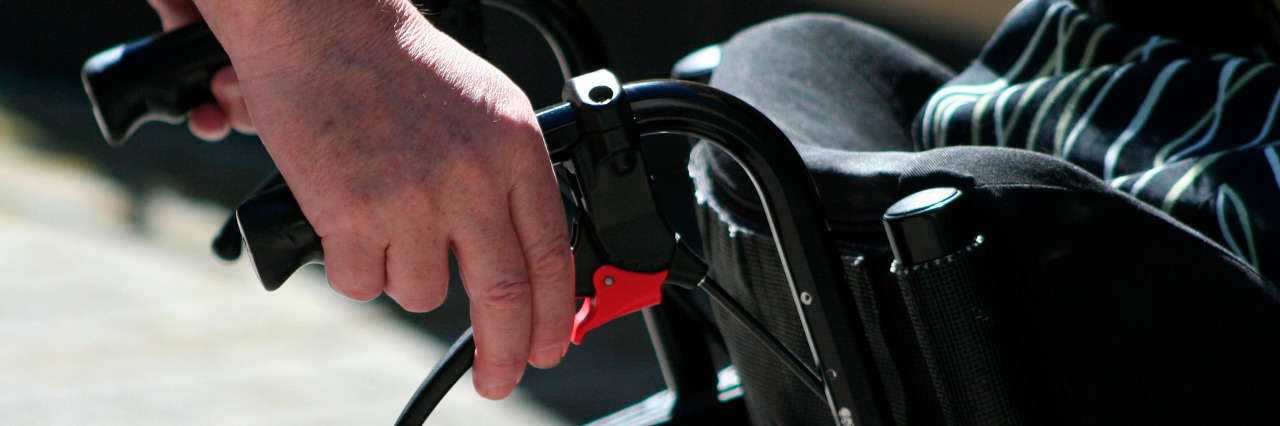 Why You Shouldn't Push Someone's Wheelchair Without Permission Pushing a wheelchair.