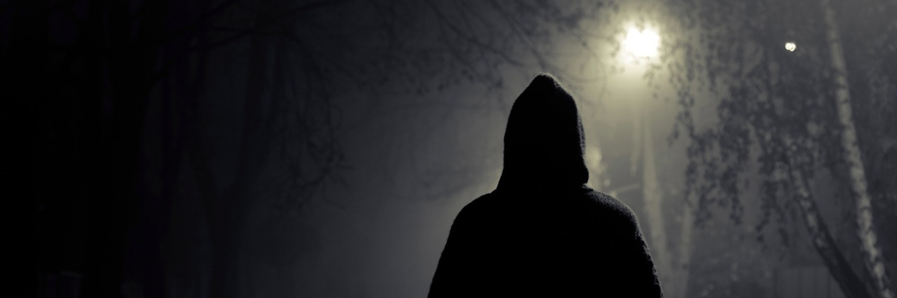 When an Encounter With a Stranger Triggered My PTSD stranger walking the streets on a cold foggy night